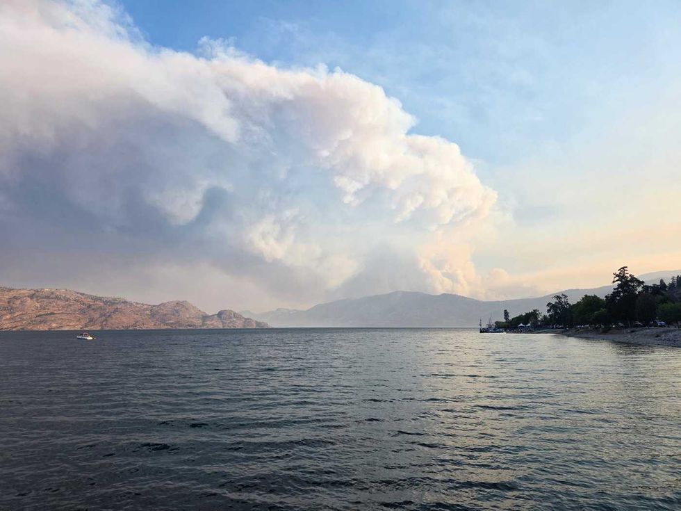 20,000 flee as explosive B.C. wildfire burns homes