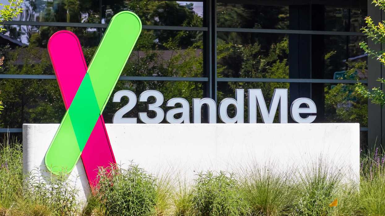 23andme sign and logo in front of a building