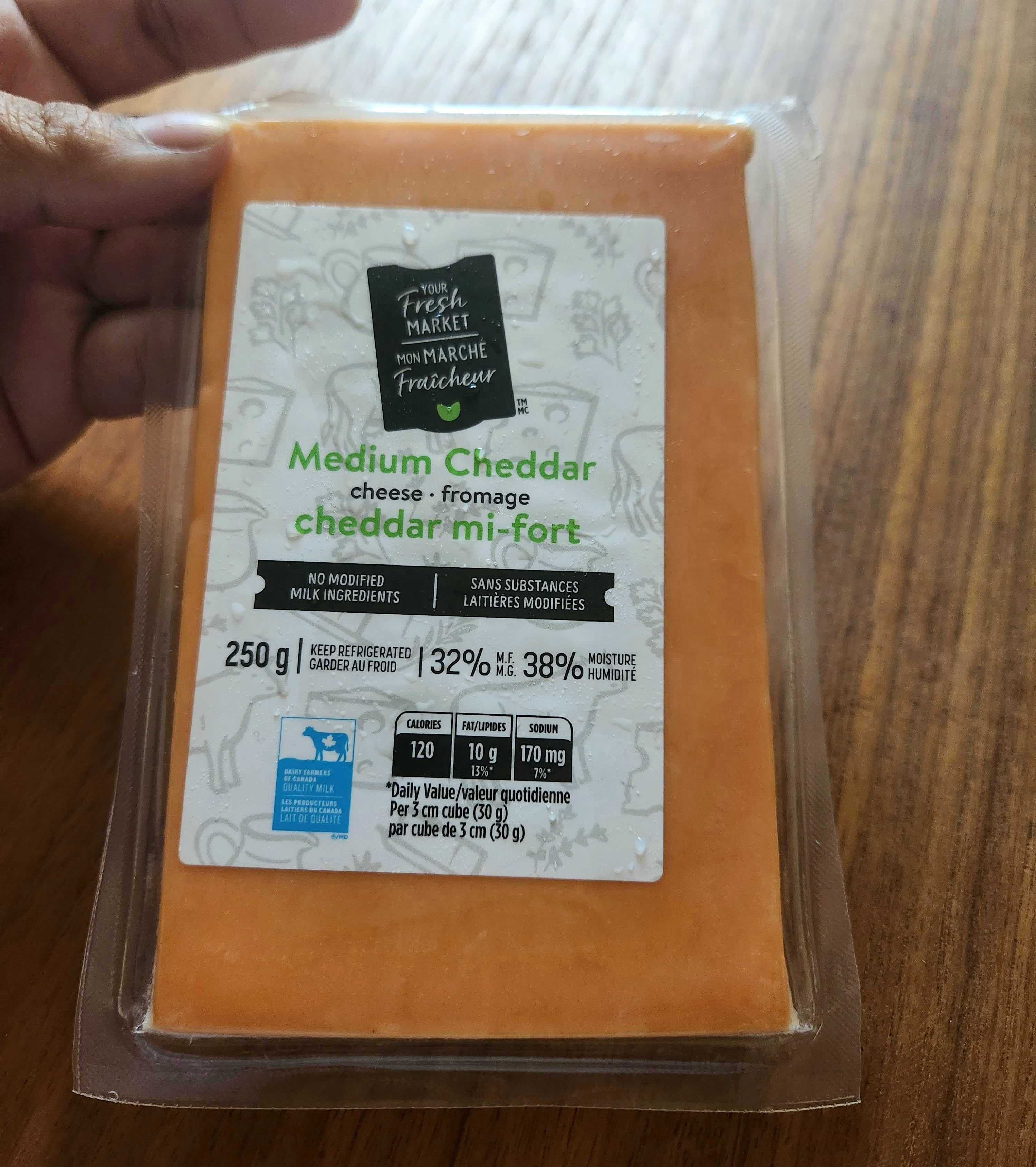 250 grams of Your Fresh Market brand medium cheddar cheese from Walmart for $6.07.