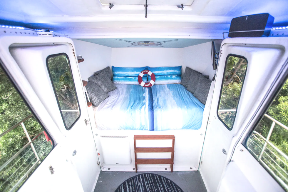 A 12 feet queen memory foam bed in a lifeguard tower at the listing.