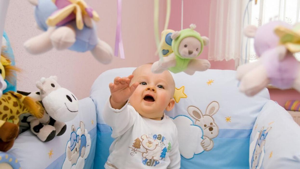 A baby in a crib.