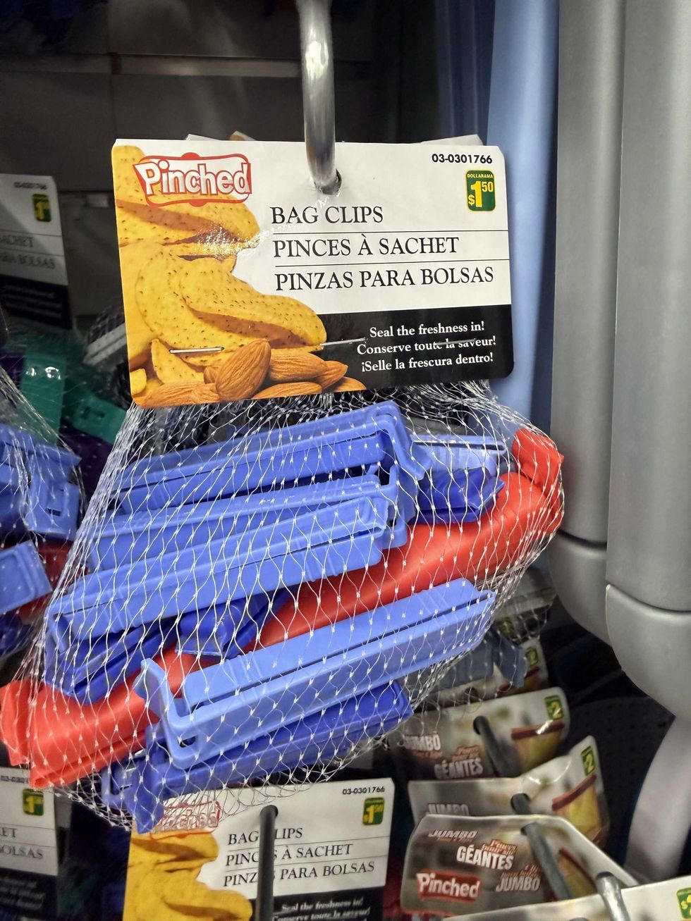 A bag filled with blue and red bag clips.