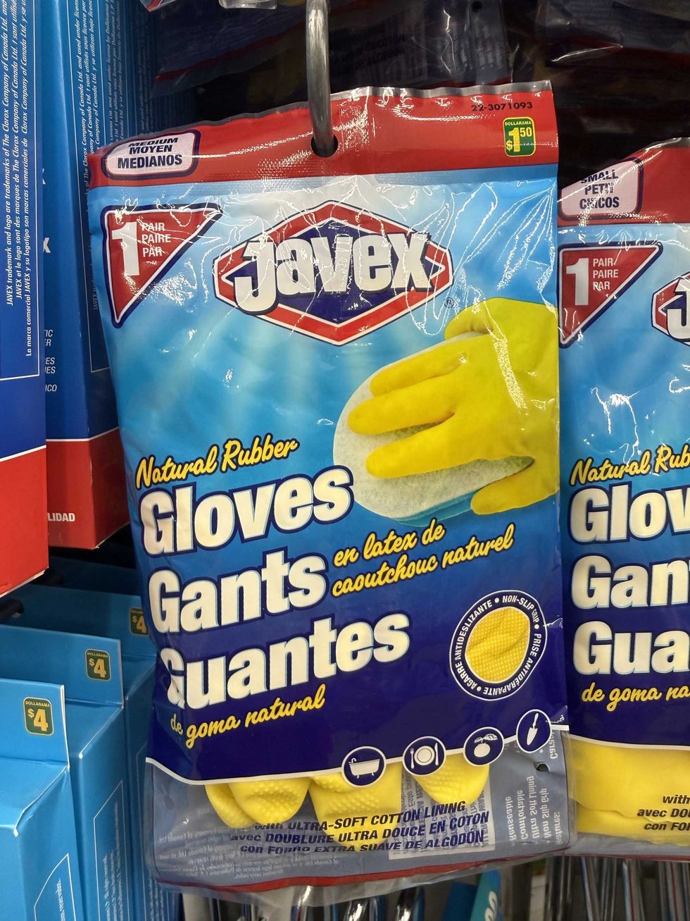 A bag with yellow rubber gloves inside.