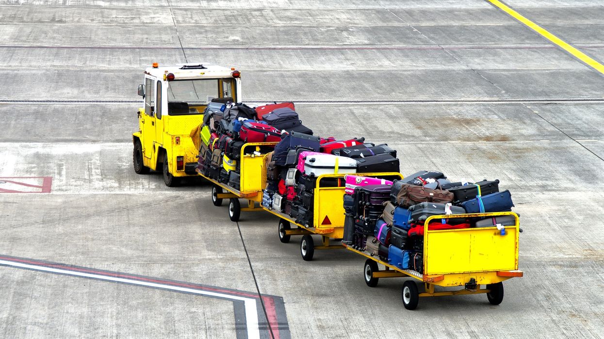 A baggage trolly on an airport tarmac (illustrative).