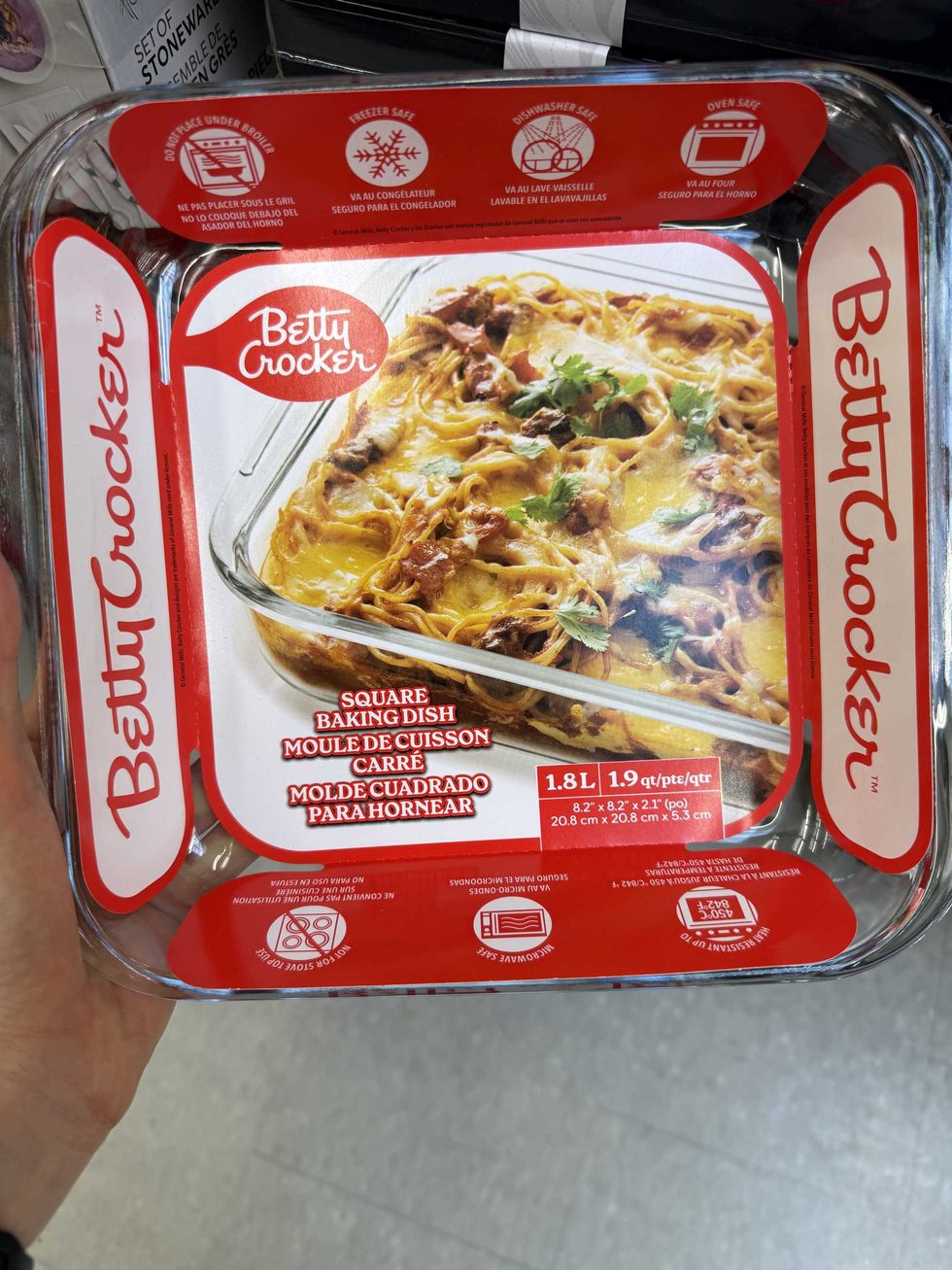 A baking dish that says Betty Crocker on it and a picture of the dish with pasta in it.