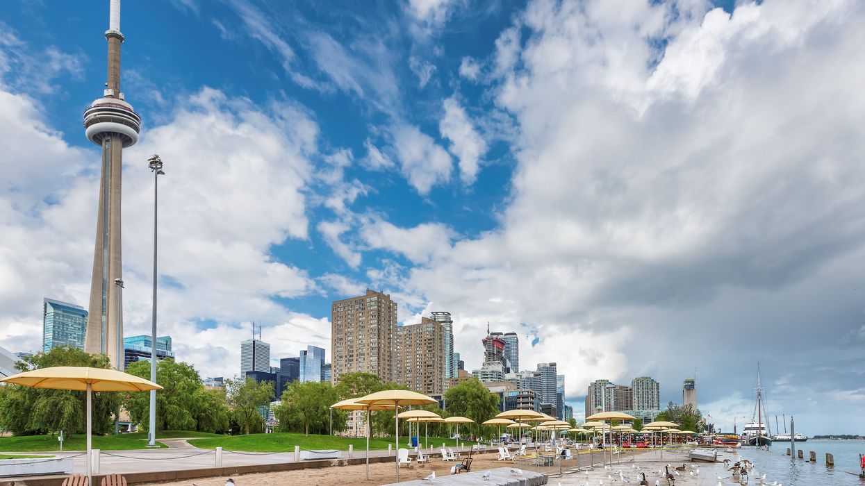 A beach in Toronto with the CN Tower in the background.