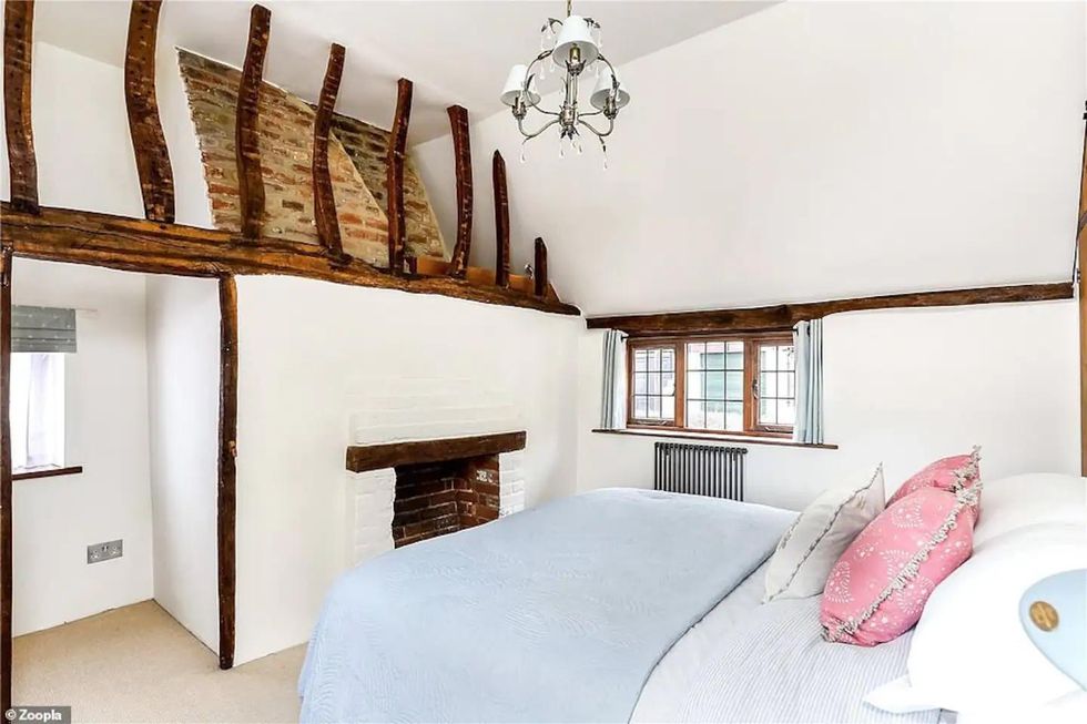A bedroom inside the Honeysuckle Cottage.