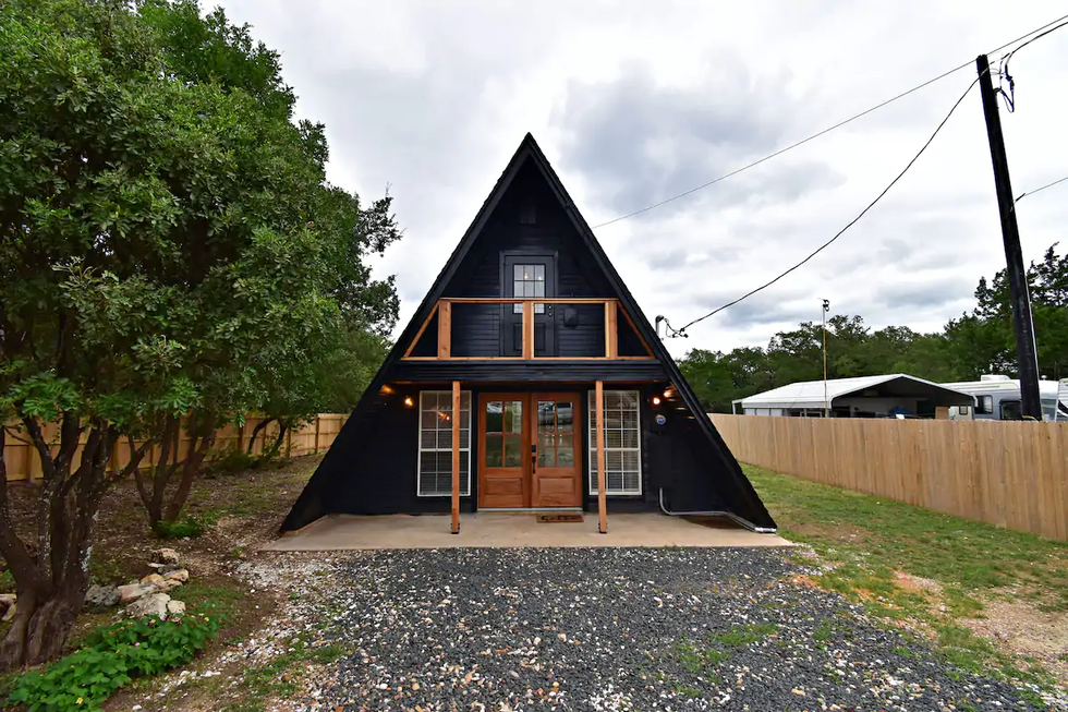 A black A-frame cabin.