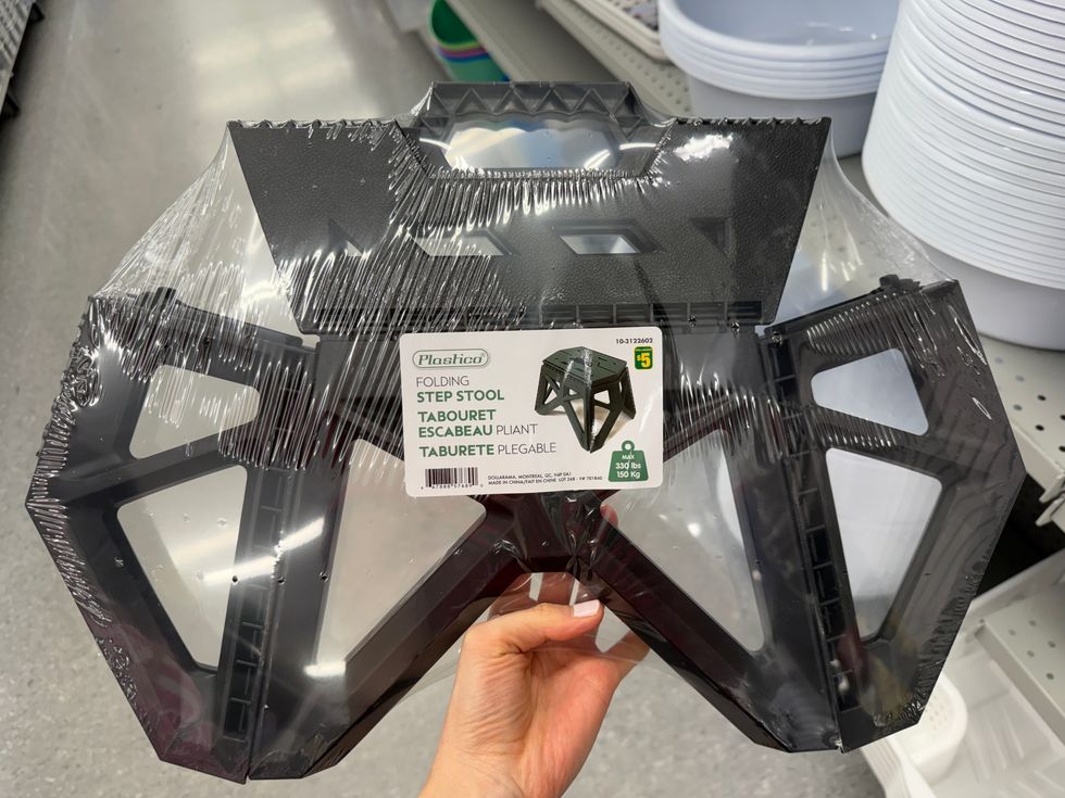 A black folding step stool.