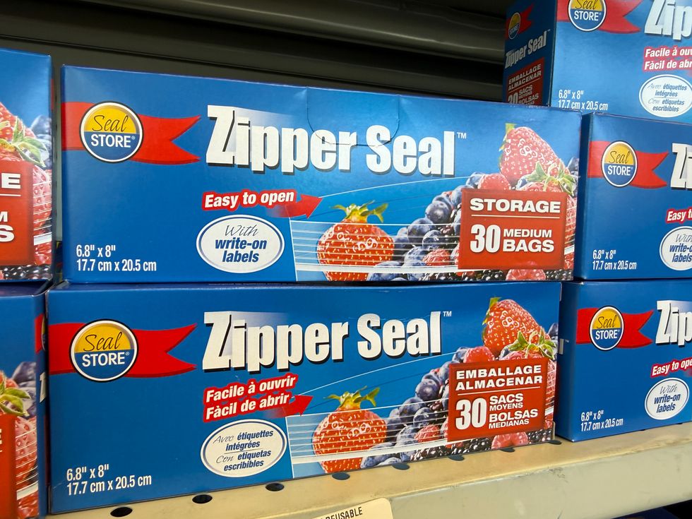 A blue, red and white box that says Zipper Seal and shows a clear bag with fruit inside.