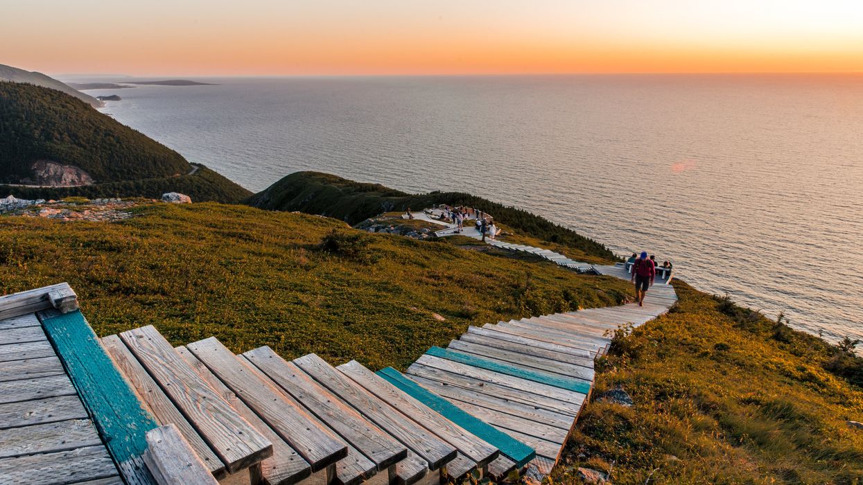 A boardwalk trail in Canada seen at sunset.