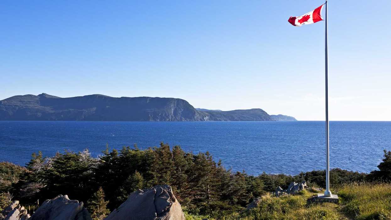 A Canadian flag flies at the Lobster Cove Head Lighthouse near Rocky Harbour, Newfoundland.
