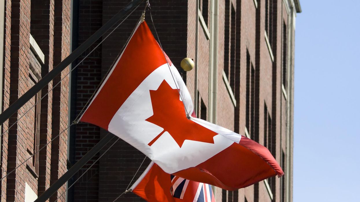 A Canadian flag on a government building.