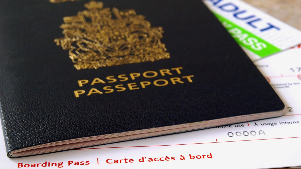 A Canadian passport and a boarding pass.