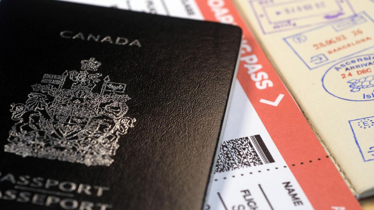 A Canadian passport and a flight ticket.