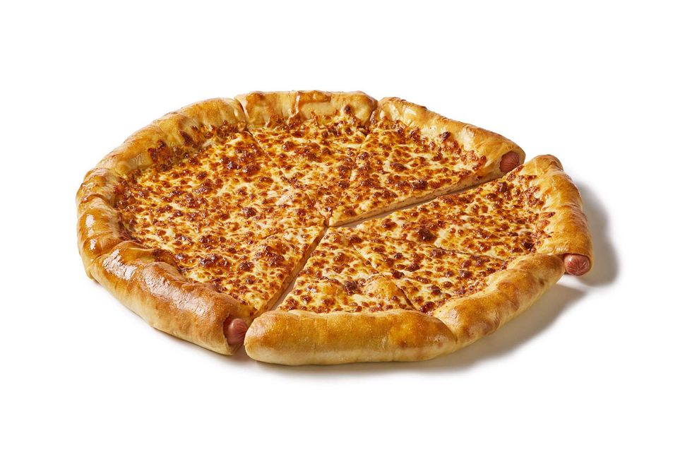A cheese pizza cut into slices, with the crust of each slice stuffed with a hot dog.