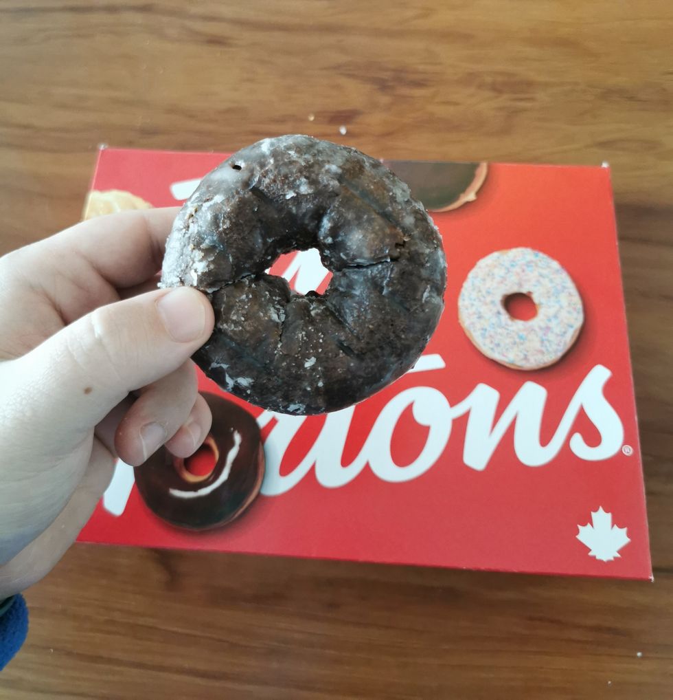A Chocolate Glazed Donut from Tim Hortons.