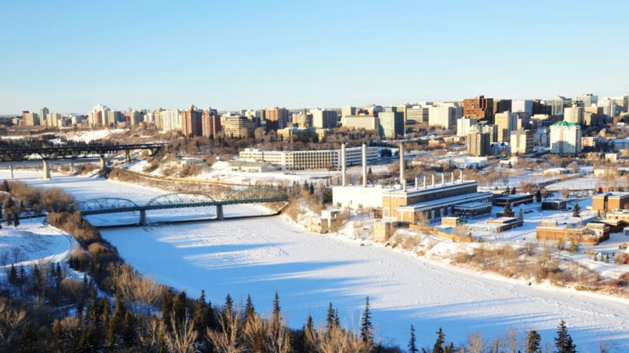 A city with snow and blue sky.