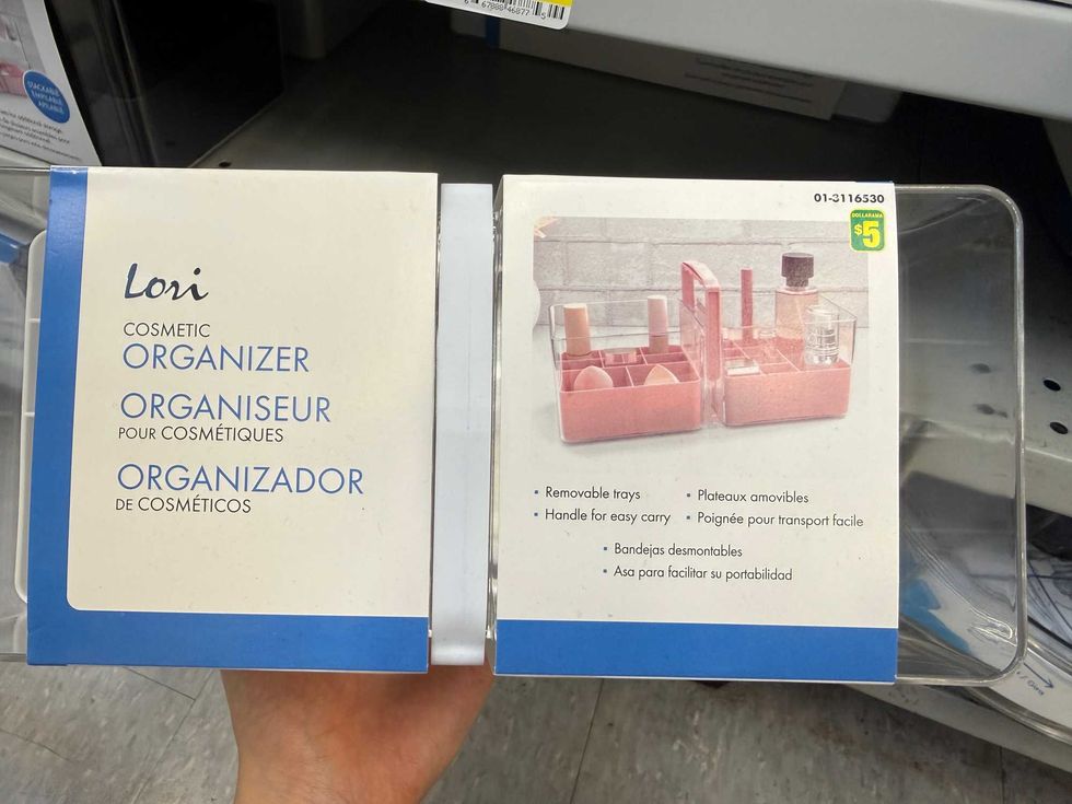 A clear container with a photo of makeup inside the organizer.