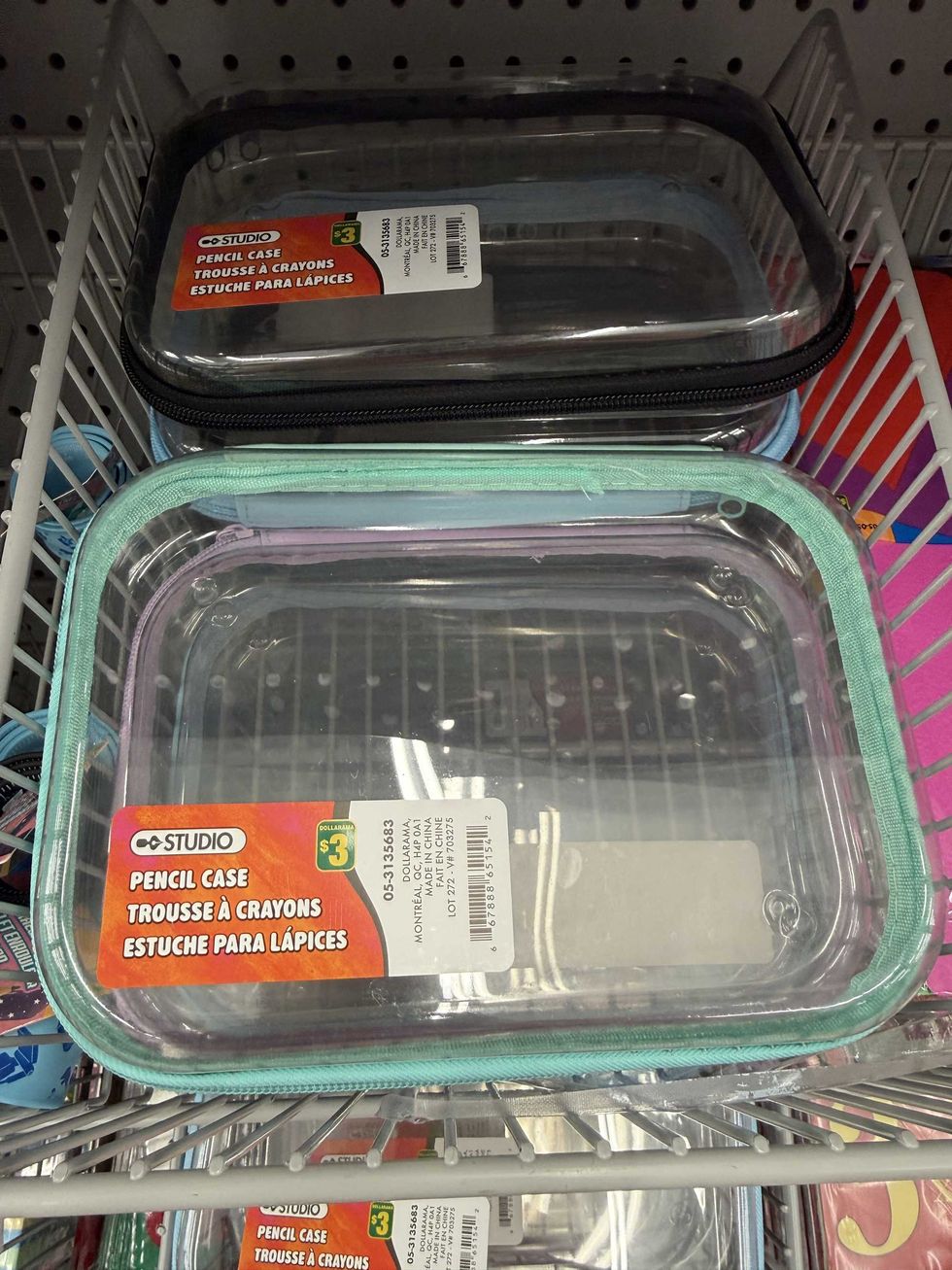 A clear pencil case with a green zipper around it.