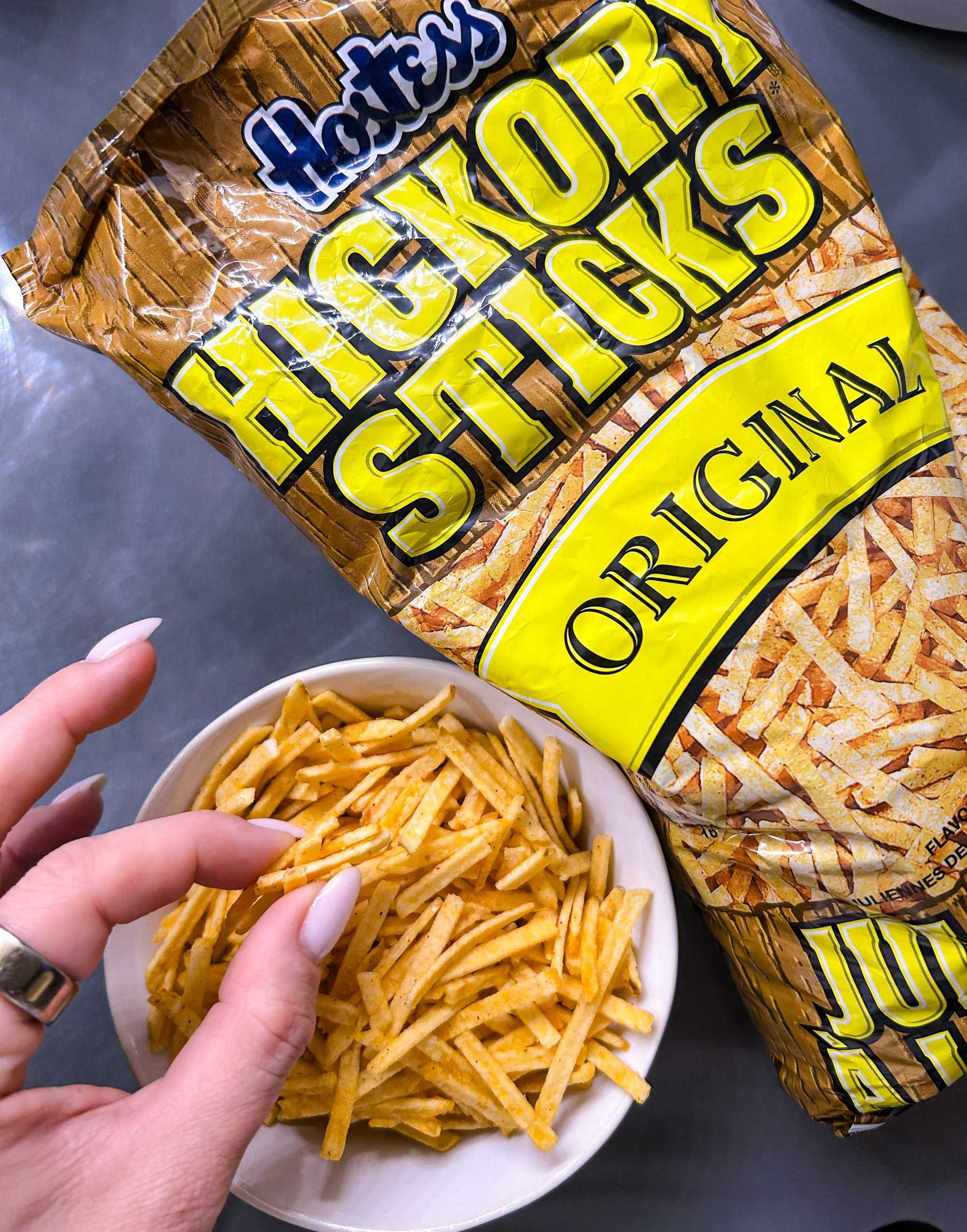 A close up photo of someone eating hickory sticks