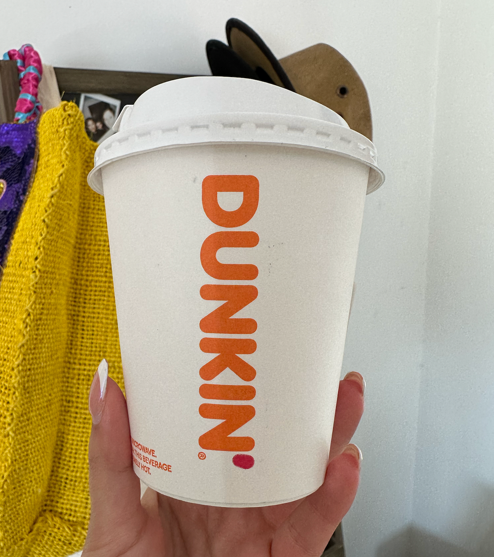 A coffee cup from Dunkin'.