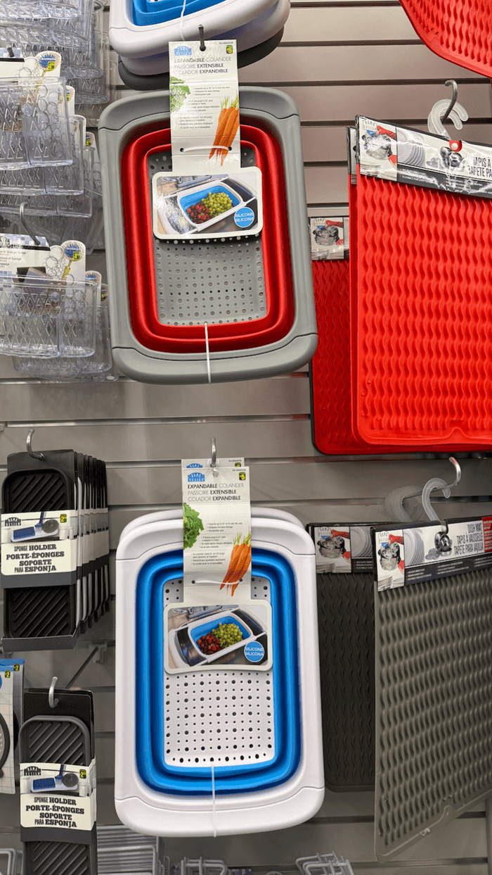 A colander on a rack at a store.
