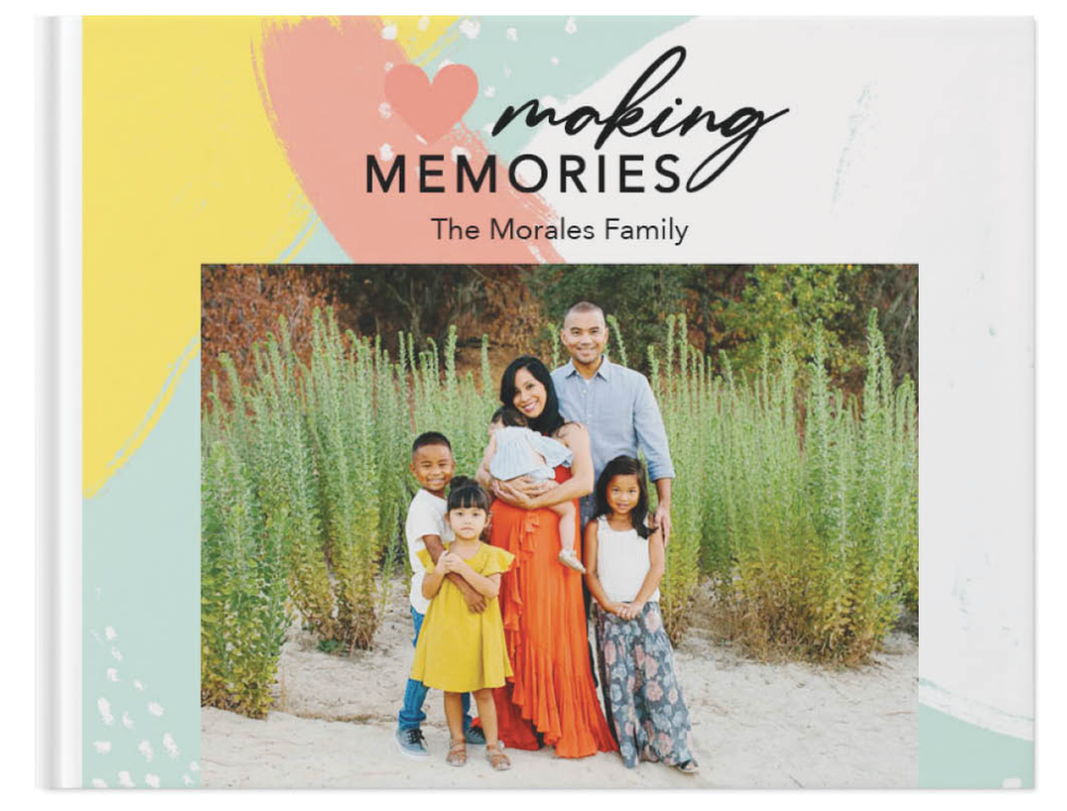 A colourful album with a photo of a family on it.
