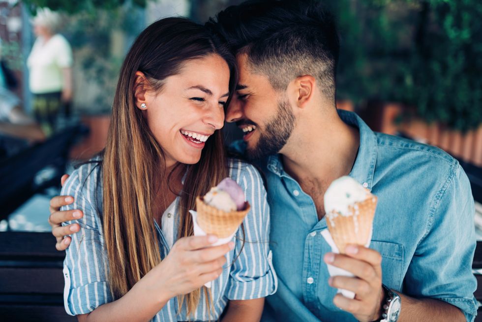 A couple eating ice cream.
