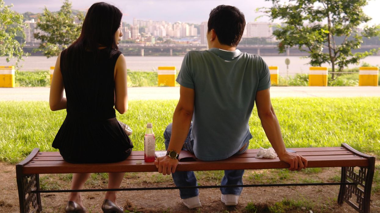 A couple on a bench.