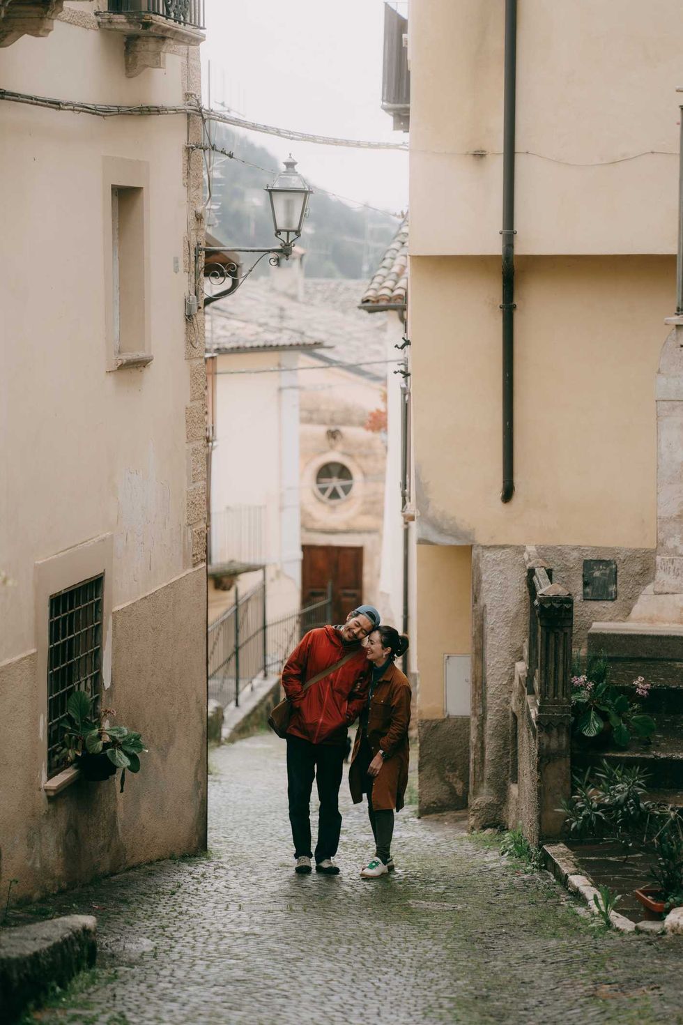 A couple on an old European street.