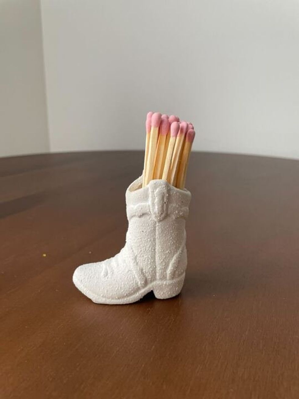 A cowboy boot matchbox.