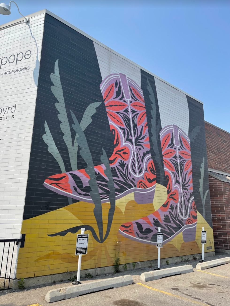 A cowboy boot mural.