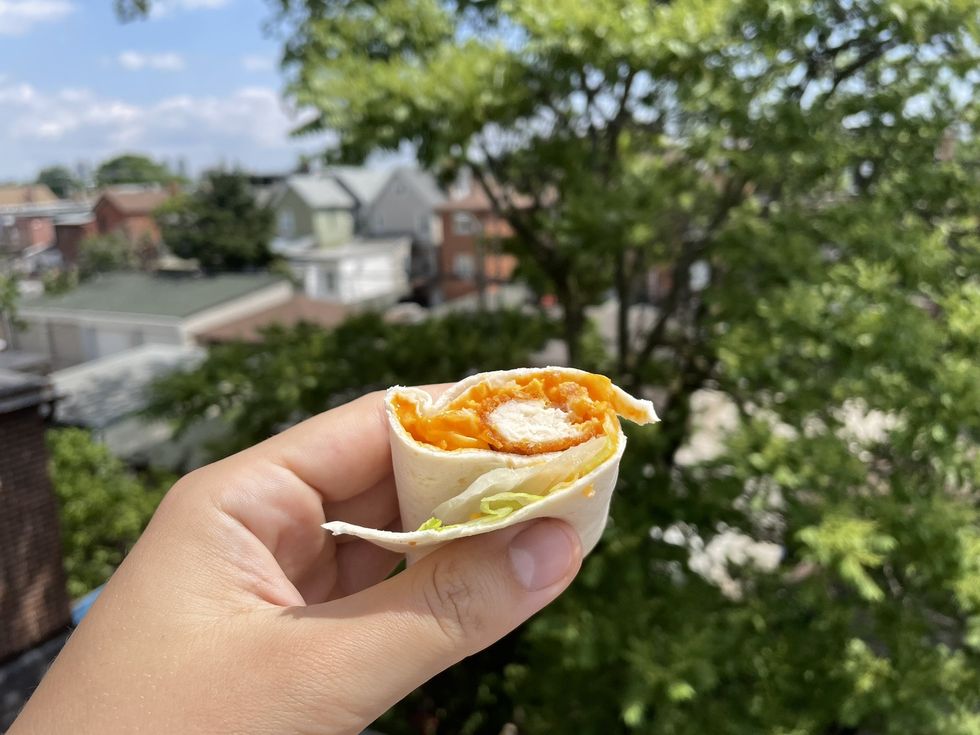 A cross section of the McDonald's Spicy Buffalo Chicken Snack Wrap.