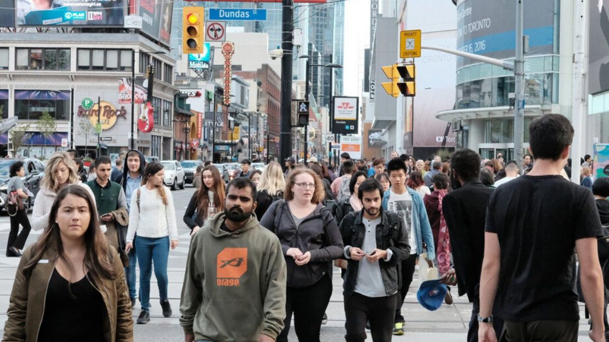 A crowd of people in downtown Toronto.