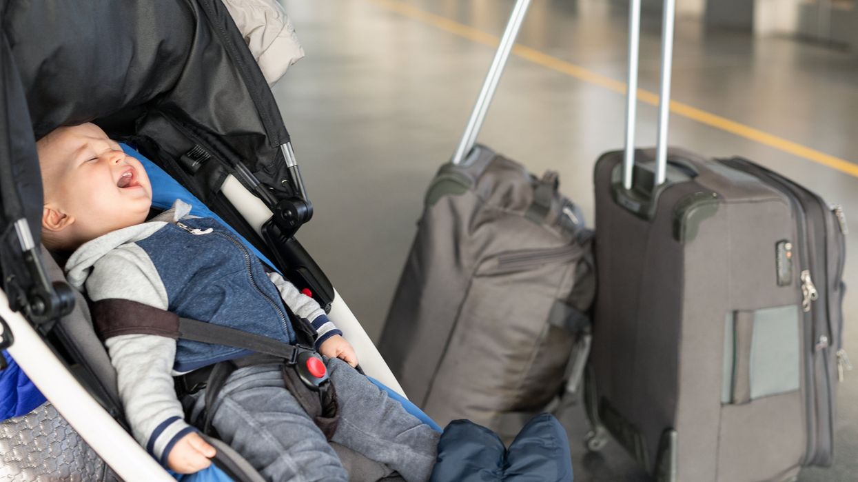 A crying baby at an airport.
