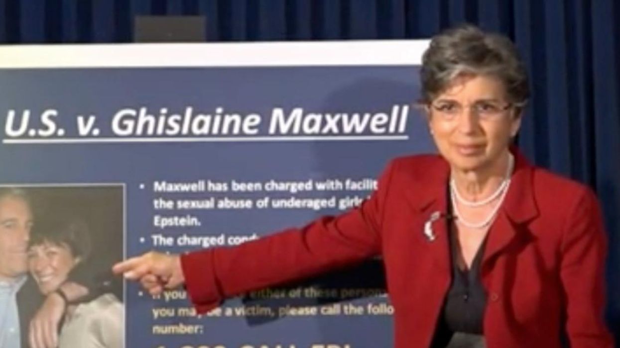 A DOJ official points to a photo of Jeffrey Epstein and Ghislaine Maxwell.