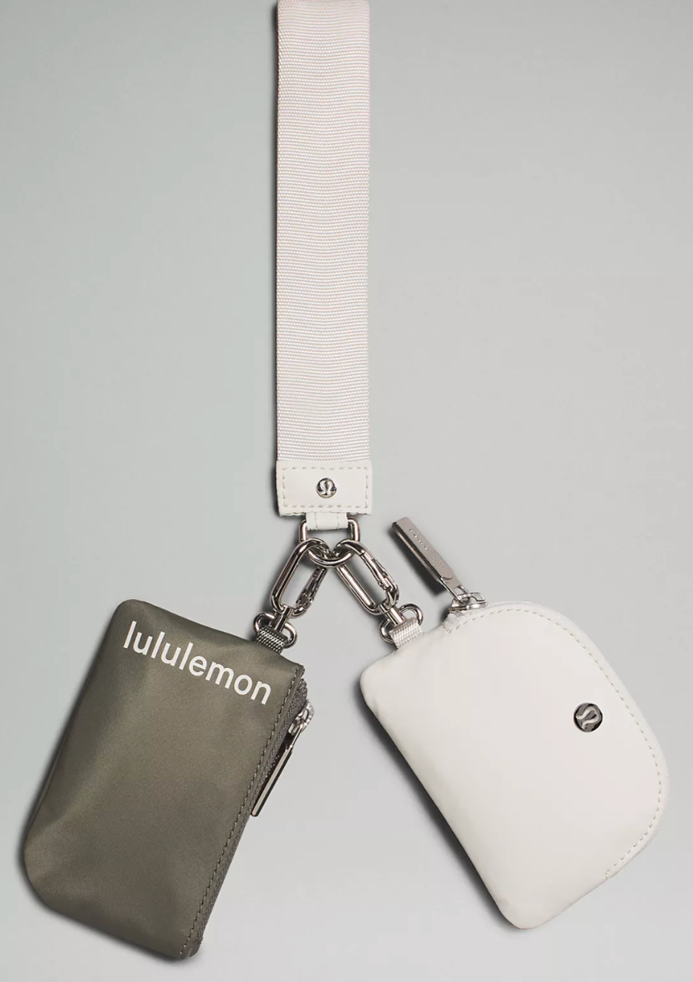 A dual pouch Lululemon wristlet in beige and grey.