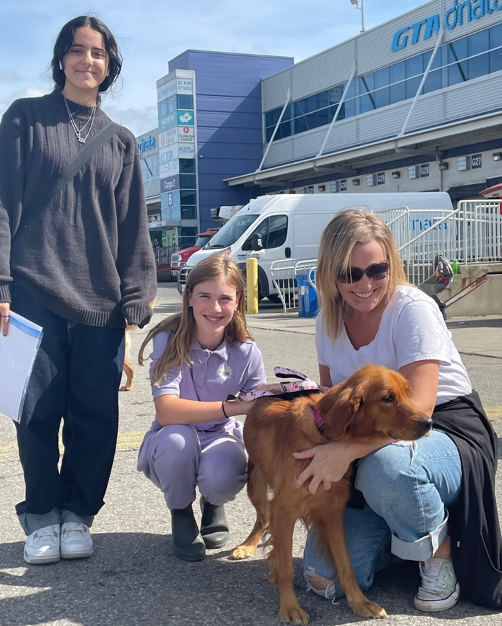 A family poses with their new furbaby.
