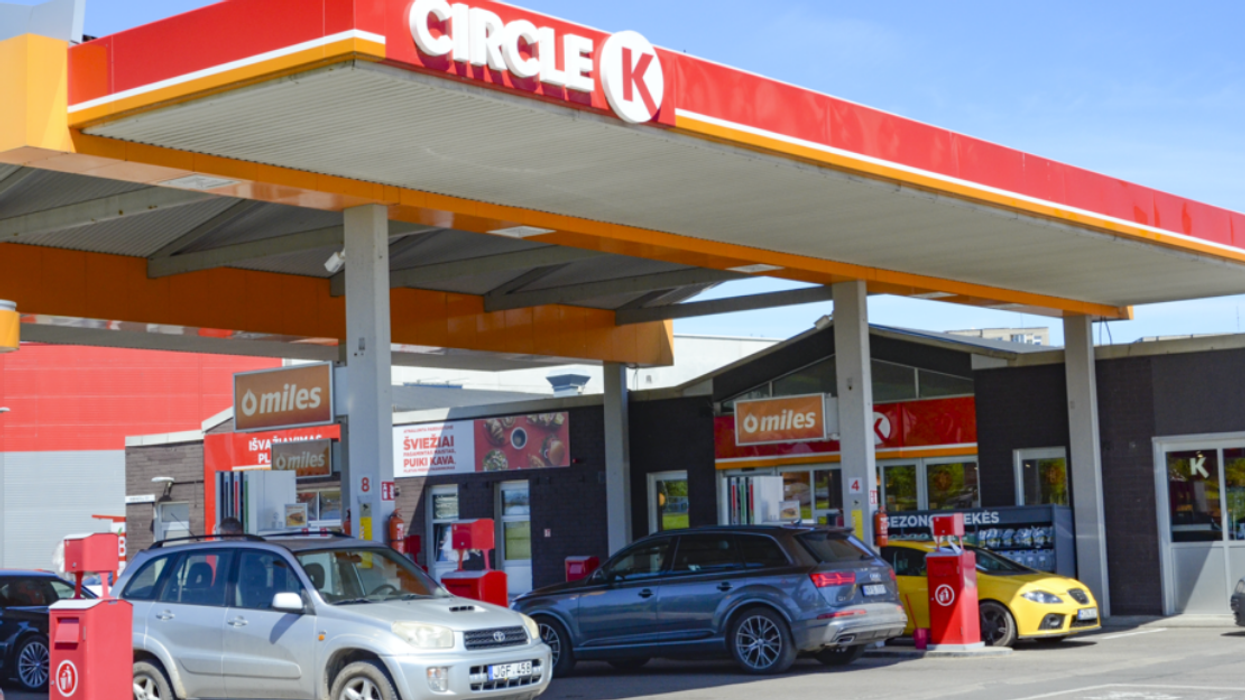 A few cars are reloading at a Circle K gas station.