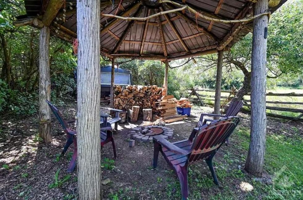A fireplace at 76 Crystal Road, Jasper, ON.