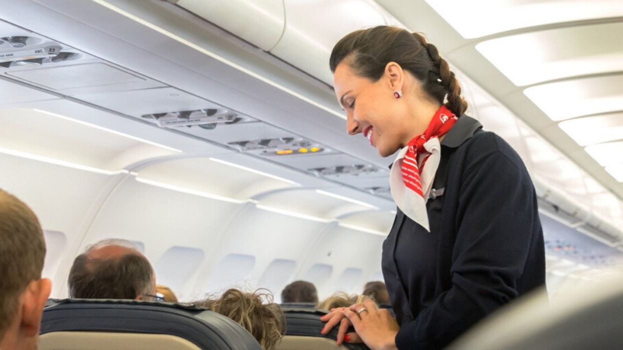 A flight attendant on an airplane.