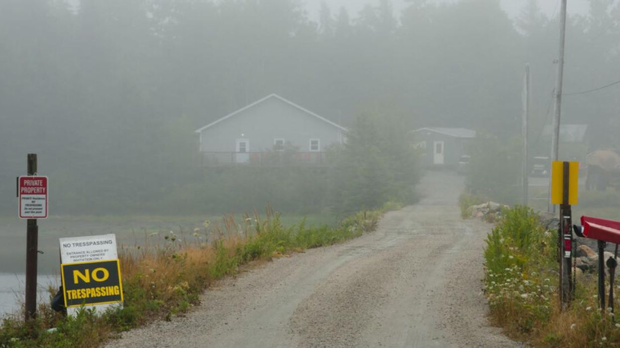 A foggy road leading to Oak Island in Nova Scotia.