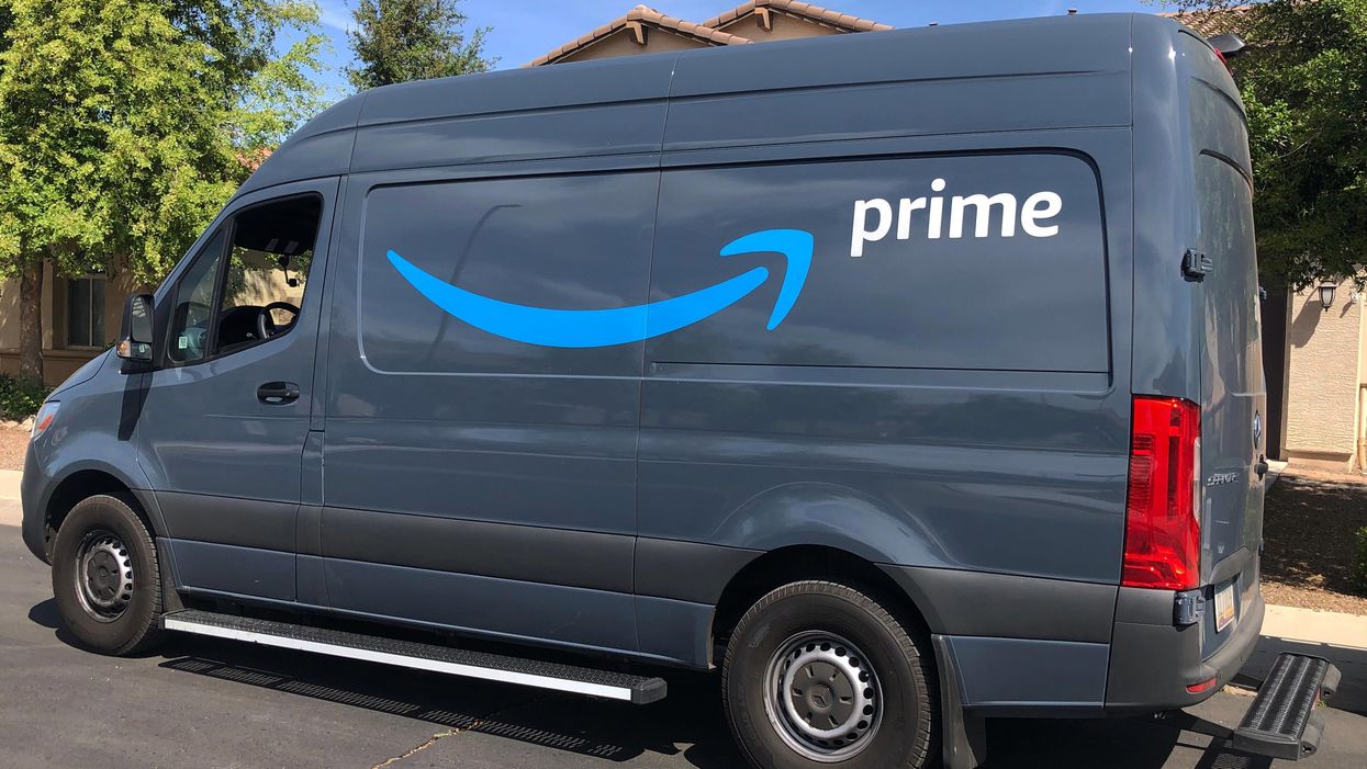 A generic picture of an Amazon delivery vehicle parked by the side of the road.
