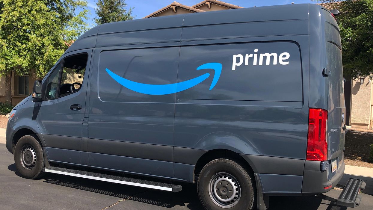 A generic picture of an Amazon delivery vehicle parked by the side of the road.