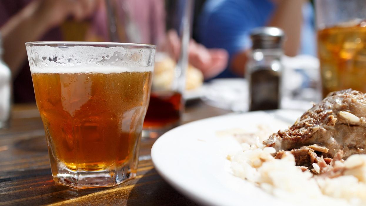 A glass of beer at a restaurant. 