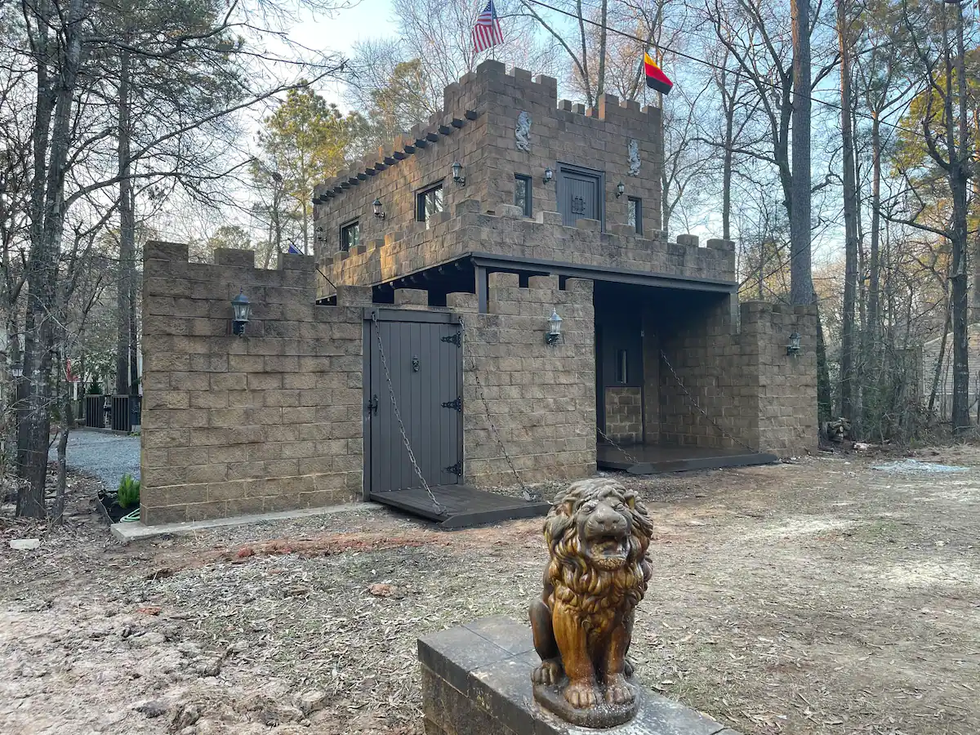 A Gothic-style castle nestled in the woods near Lake Livingston.