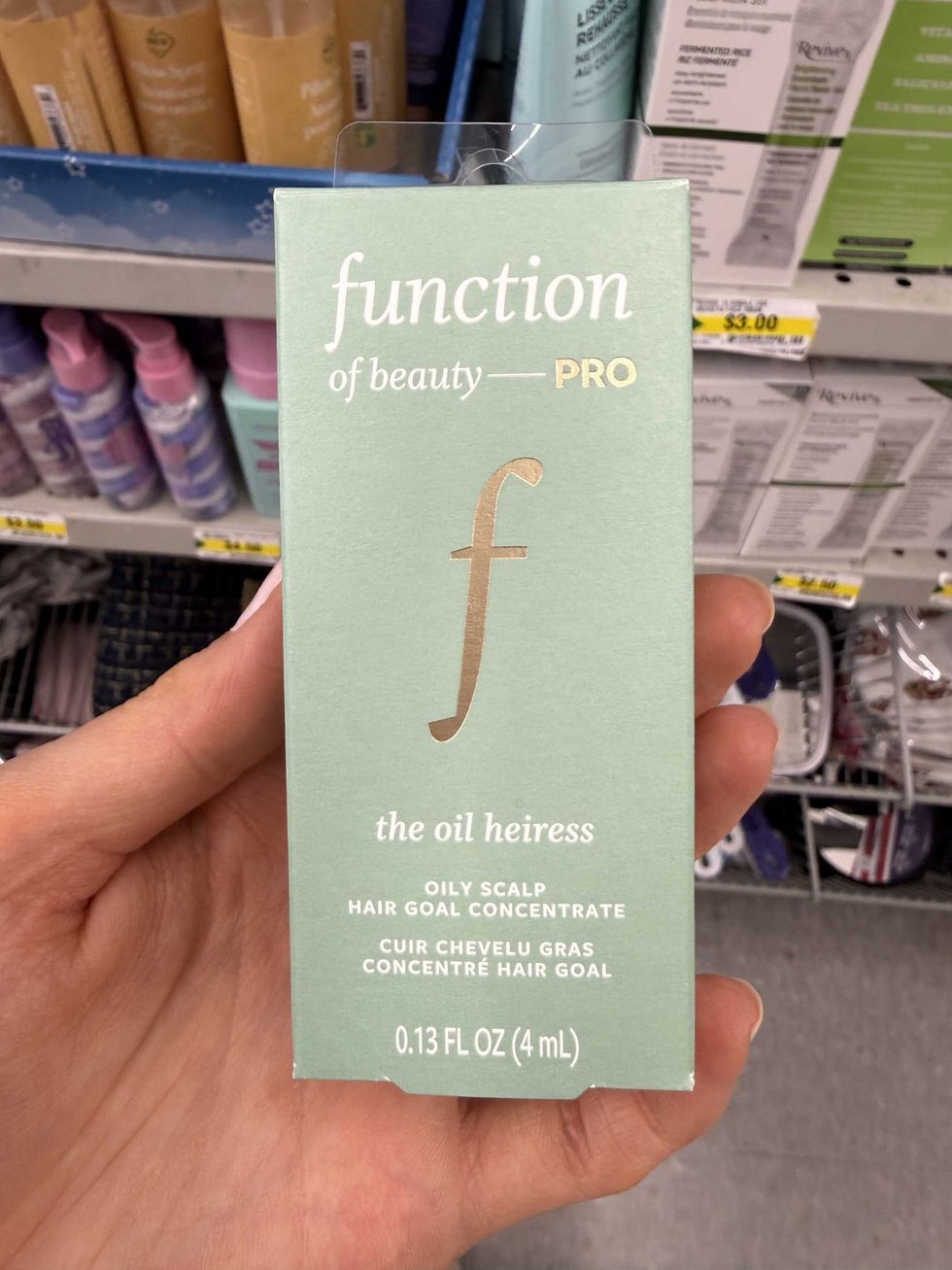 A green box that says Function of Beauty PRO the oil heiress oily scalp hair goal concentrate.