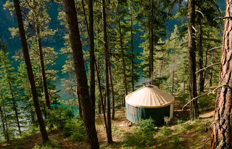 A green yurt in the forest by Anderson Lake.