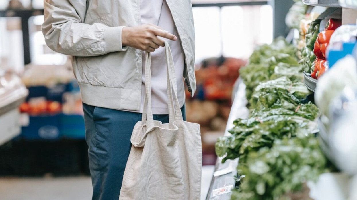 A grocery shopper in the produce aisle.